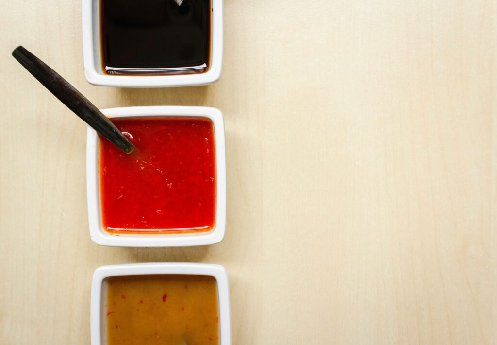 Red and yellow sauces in small containers