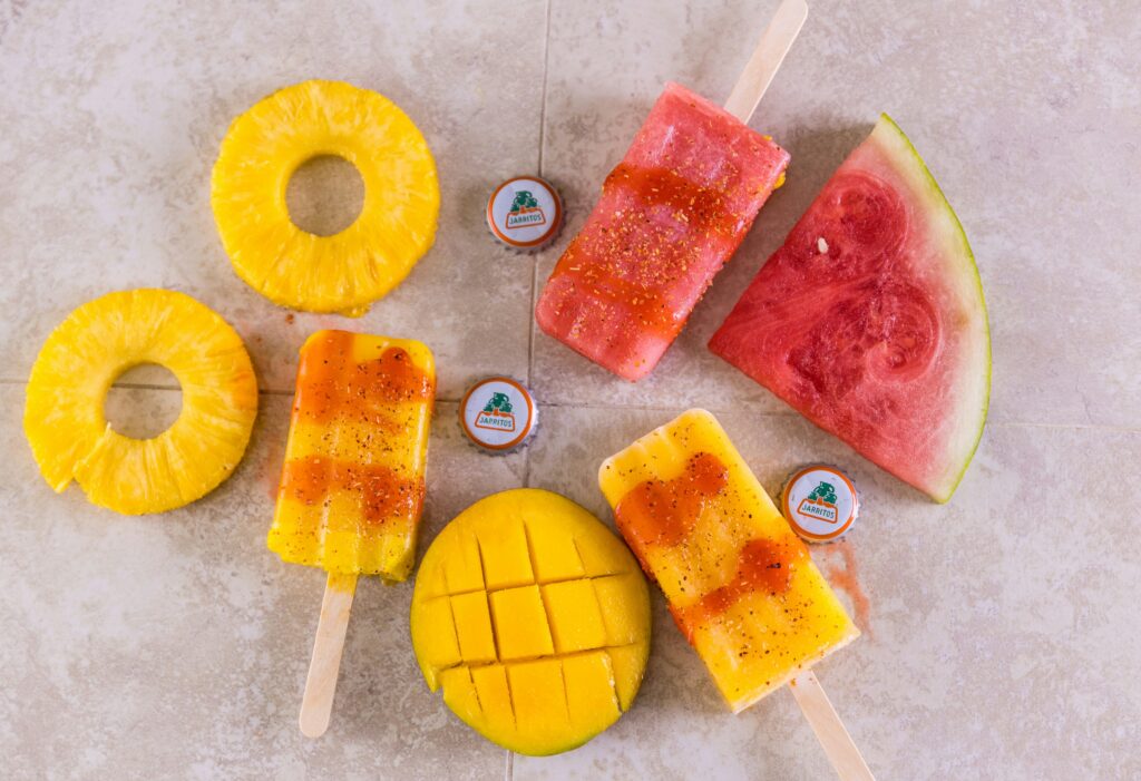 Assorted fruit popsicles on sticks