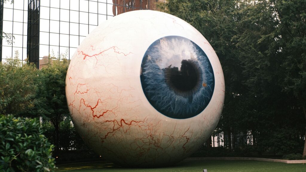 Giant eyeball sculpture outdoors