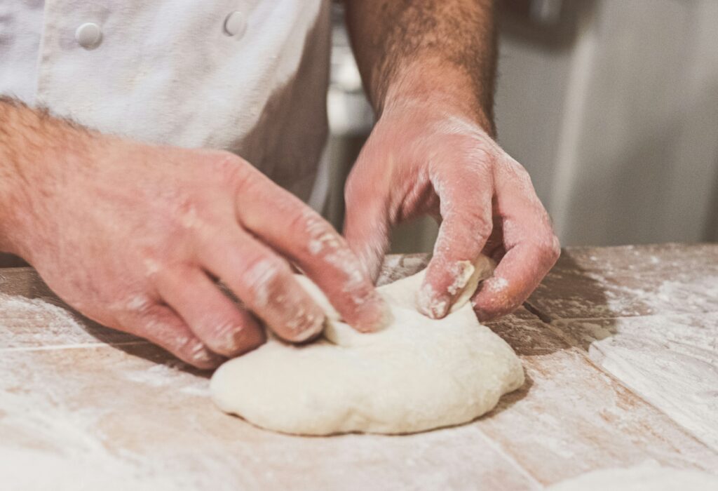 Hands kneading dough