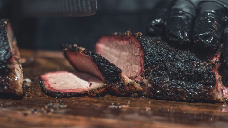 Smoked brisket sliced on a cutting board