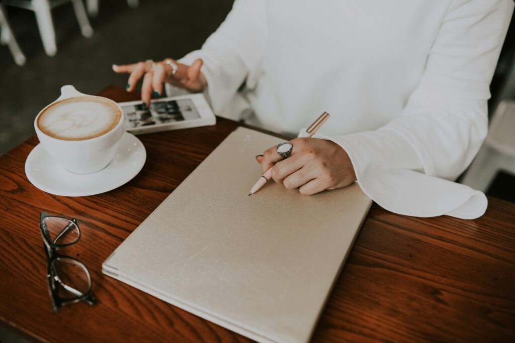 Person signing a menu at a table