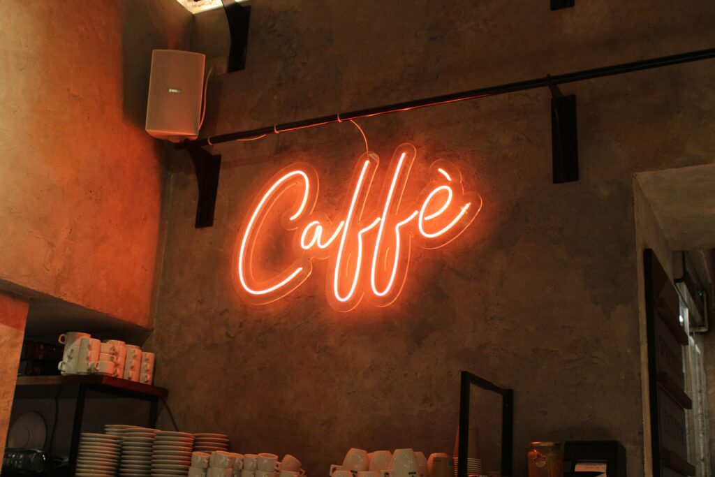 Neon café sign on a wall